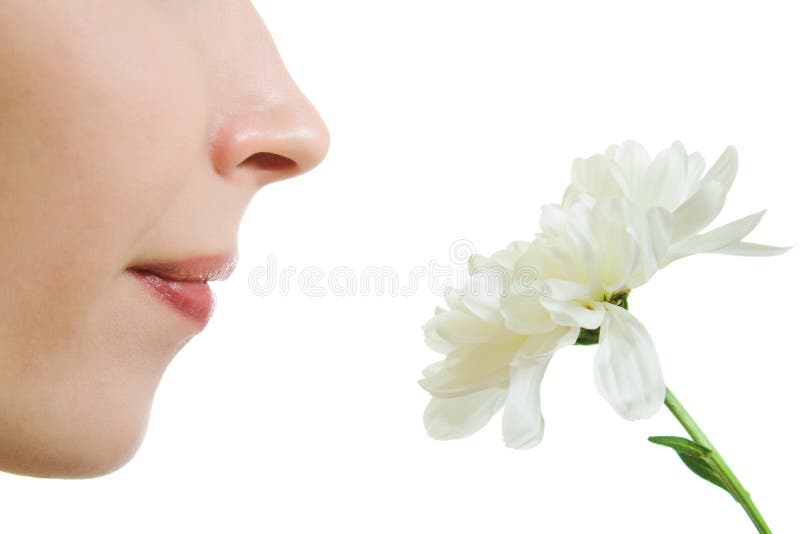 Girl smelling a flower