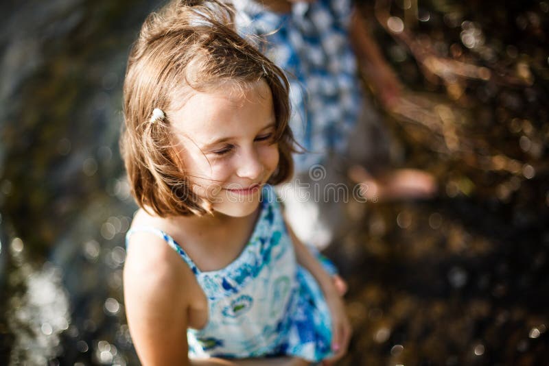 Girl smiling in the sun stock photo. Image of brother - 31299180