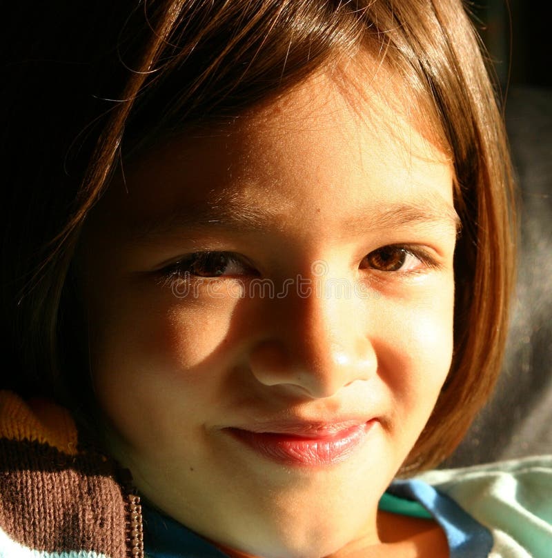 Girl smiling to a brighter future stock photography Girl smiling to a brighter future stock photography