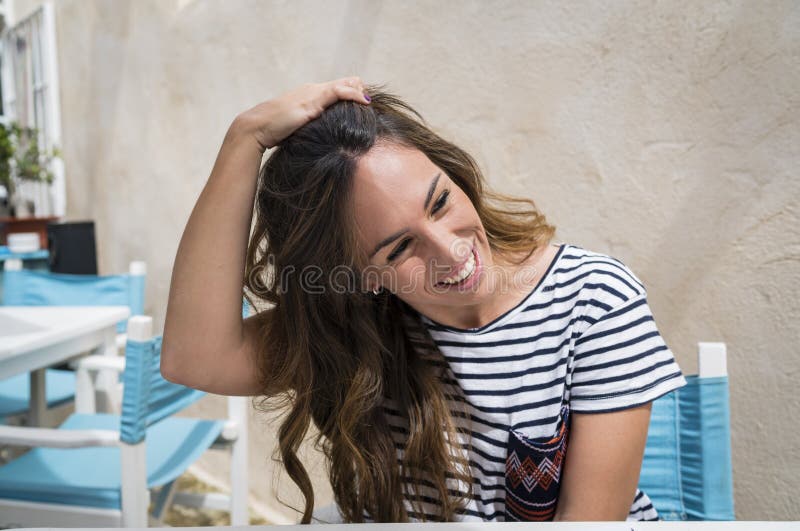 Girl smiling while touching her hair royalty free stock photos Girl smiling while touching her hair royalty free stock photos
