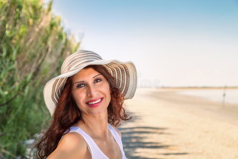 Girl smiling on tropical beach royalty free stock images