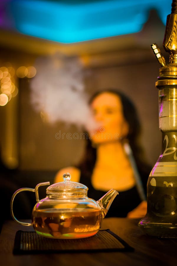 Girl Smokes a Hookah and Drink Tea in the Bar Stock Image Image of