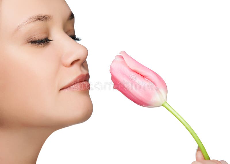 Girl sniffing tulip portrait