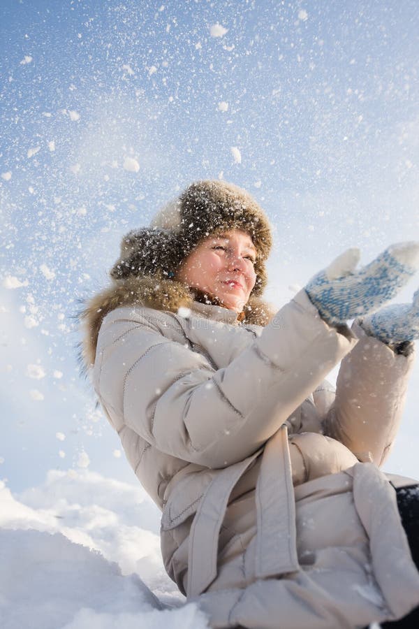 Girl in snow dust stock image
