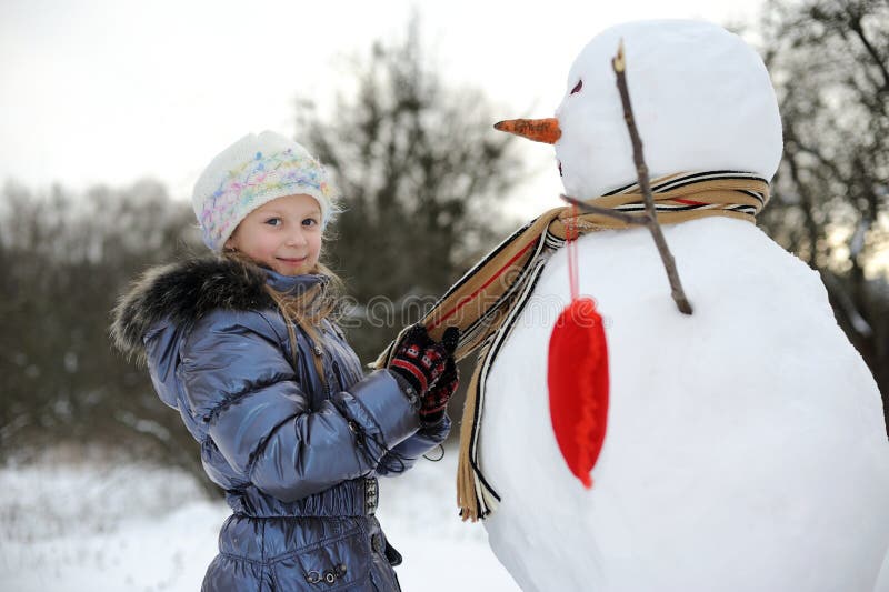 Girl with snowman