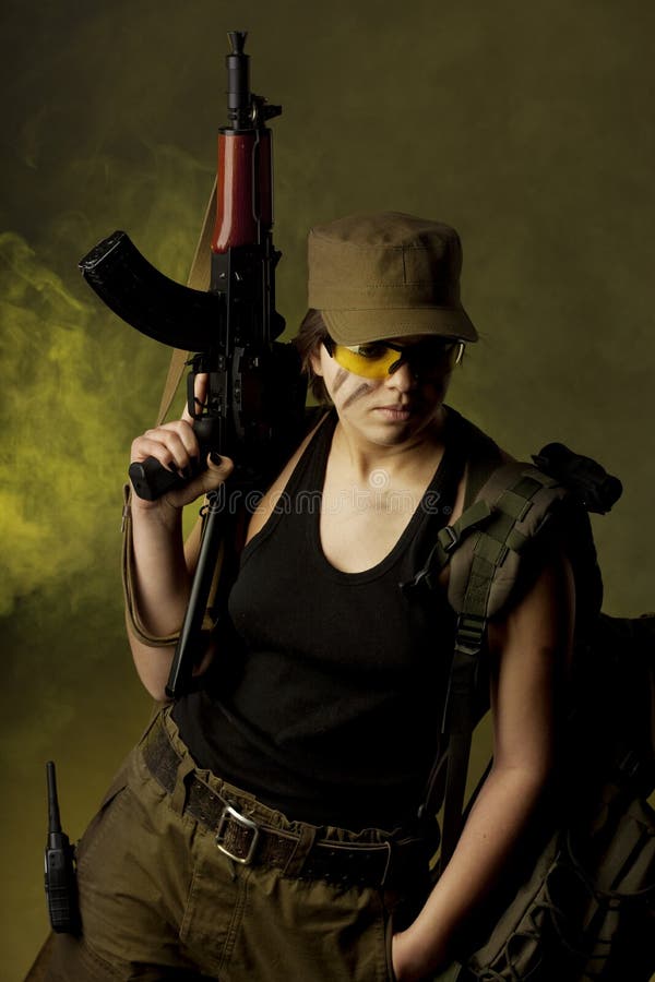 Girl soldiers in the smoke royalty free stock images