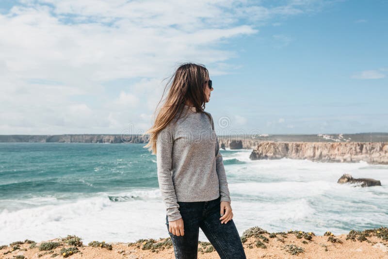 The Girl in Solitude Admires a Beautiful View of the Atlantic Ocean