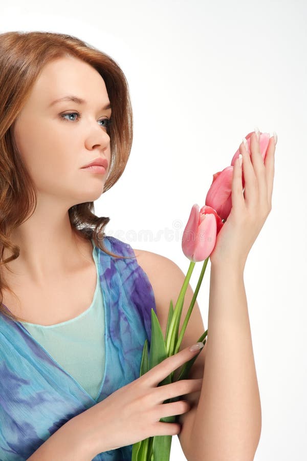 Girl standing holding tulips