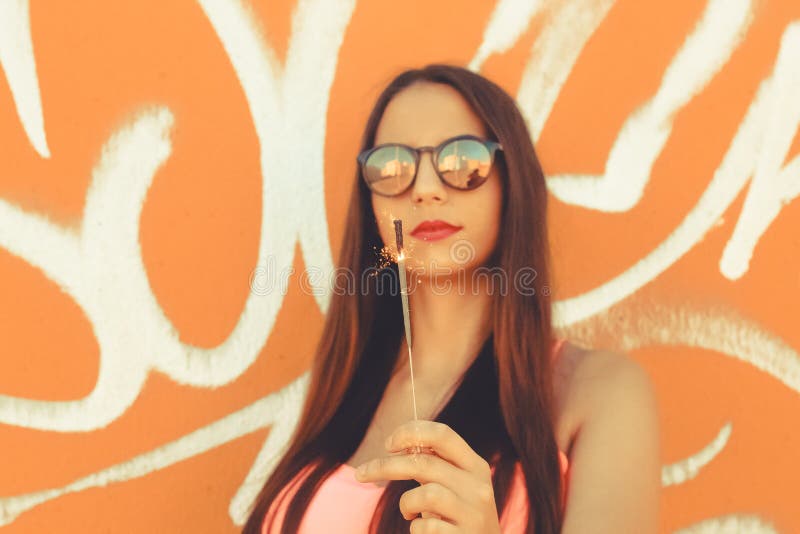 Girl standing posing with a sparkler royalty free stock images Girl standing posing with a sparkler royalty free stock images