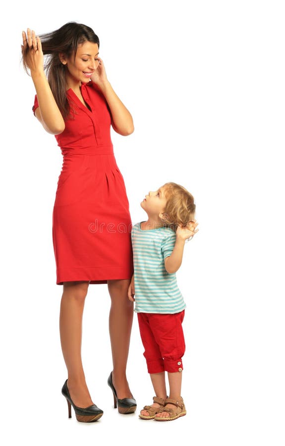 Girl stands with woman in red dress