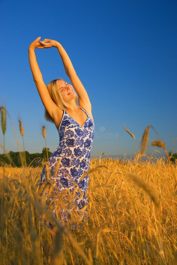 Girl stretching in the field