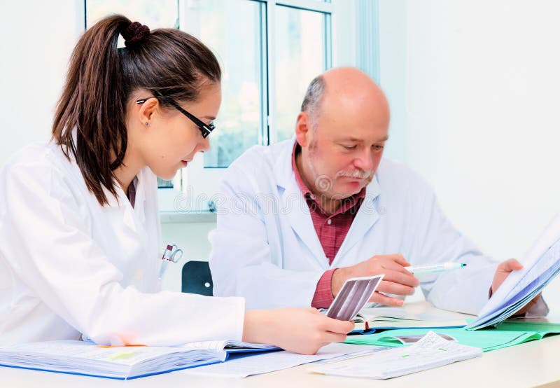 Girl student and a professor stock images