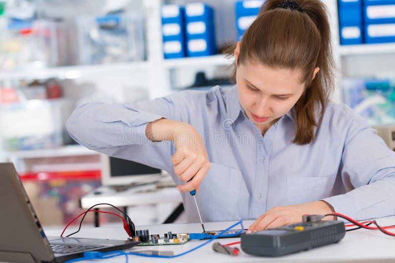 Girl Student Studying Electronic Device with Microprocessor Stock Photo