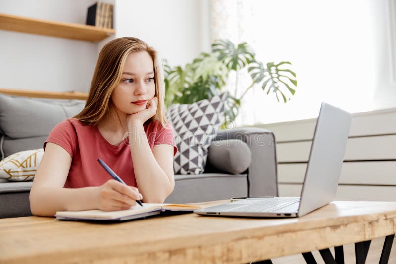 Girl studies online at home royalty free stock photo
