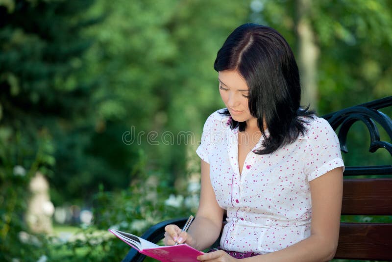 Girl sudying in park