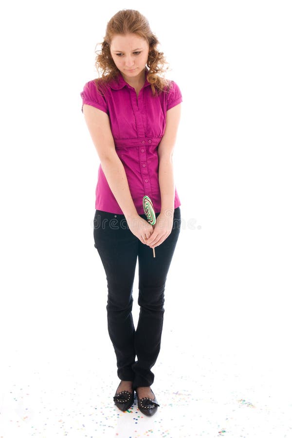 The girl with a sugar candy isolated on a white