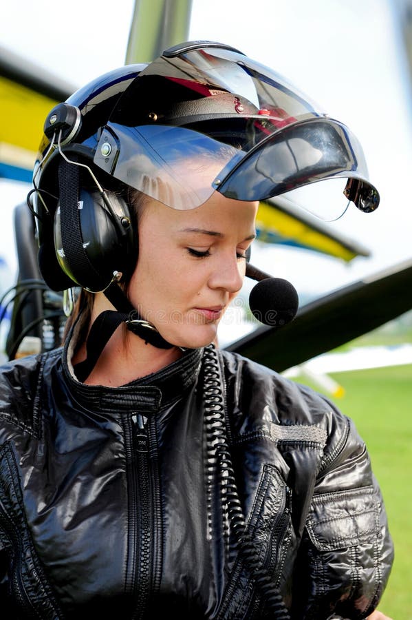 Girl suits up for flight stock image. Image of suit, headset 9631283