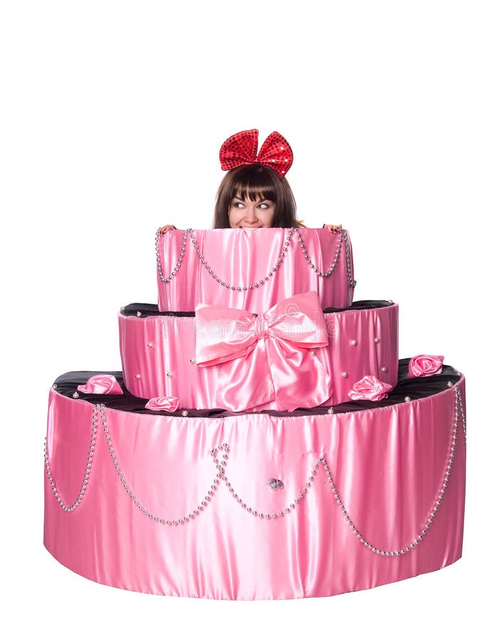 Girl, a surprise gift, looks out a toy cake