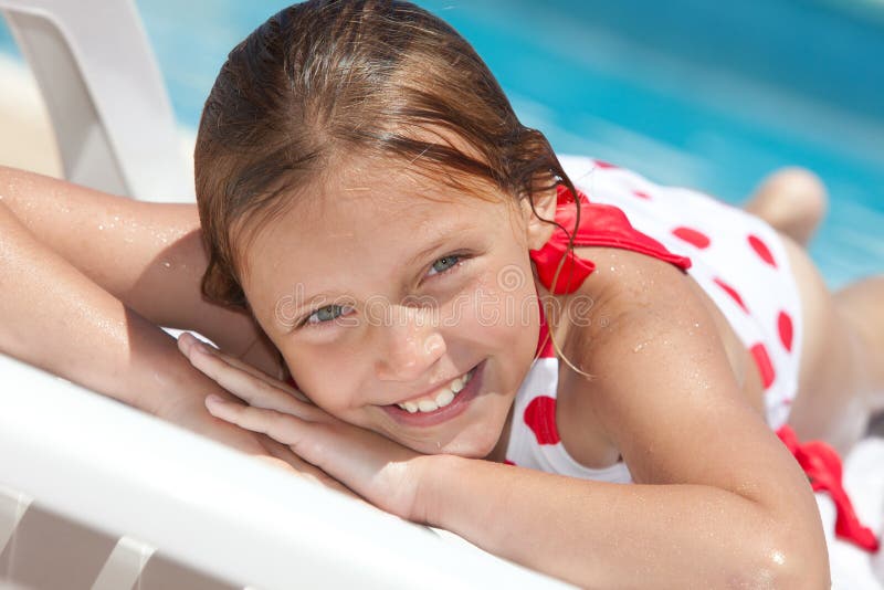 Girl by the swimming pool