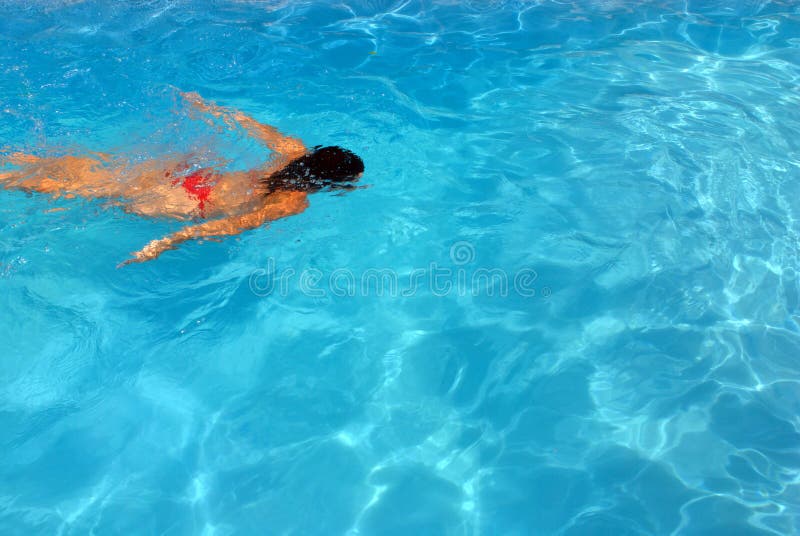 Girl in a swimming poole