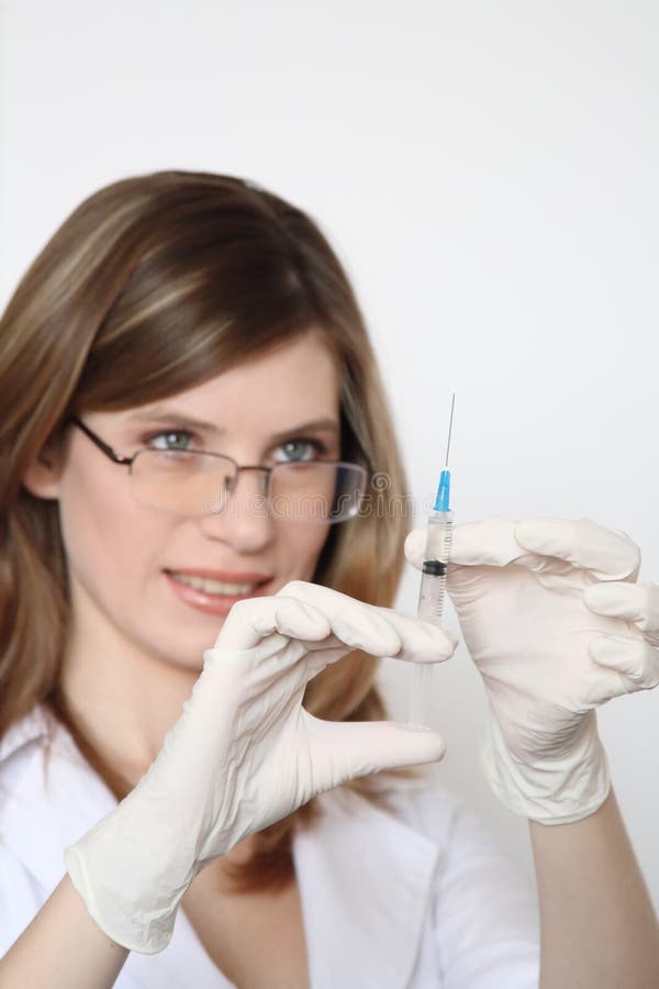 The girl with a syringe for injections