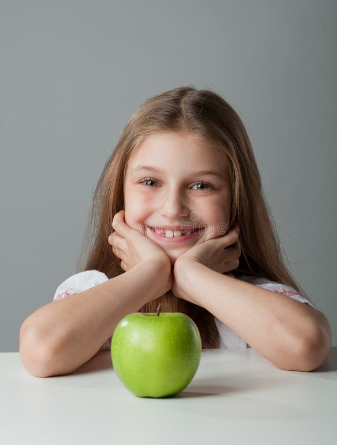 Girl at the table stock images