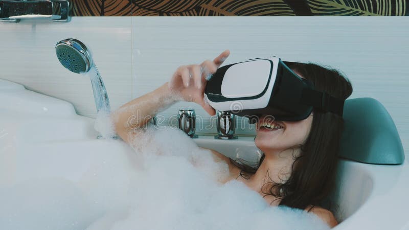 Girl Take Bath Full Of Foam In Bathroom With Virtual Reality Glasses Smile Stock Video Video