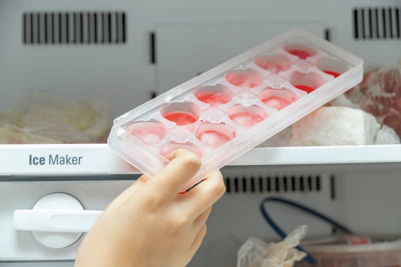 https://thumbs.dreamstime.com/b/girl-takes-out-ice-molds-freezer-to-cool-water-drinks-girl-takes-out-ice-molds-freezer-to-cool-water-220789609.jpg