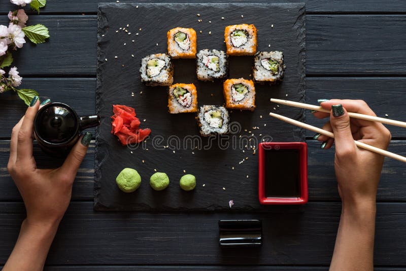 Download Girl Takes Sushi Chopsticks Stock Photo - Image of chopsticks, avocado: 118433684
