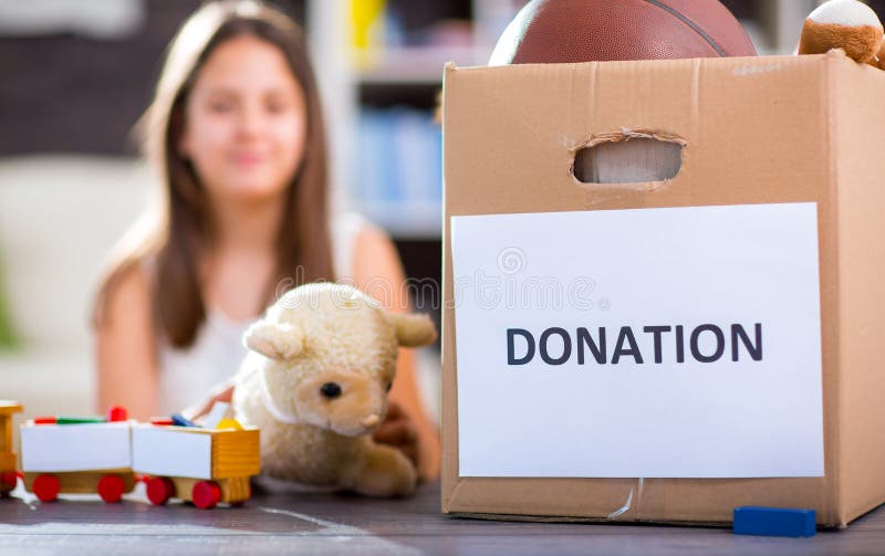 Girl Taking Donation Box Full with Stuff for Donate Stock Photo Image