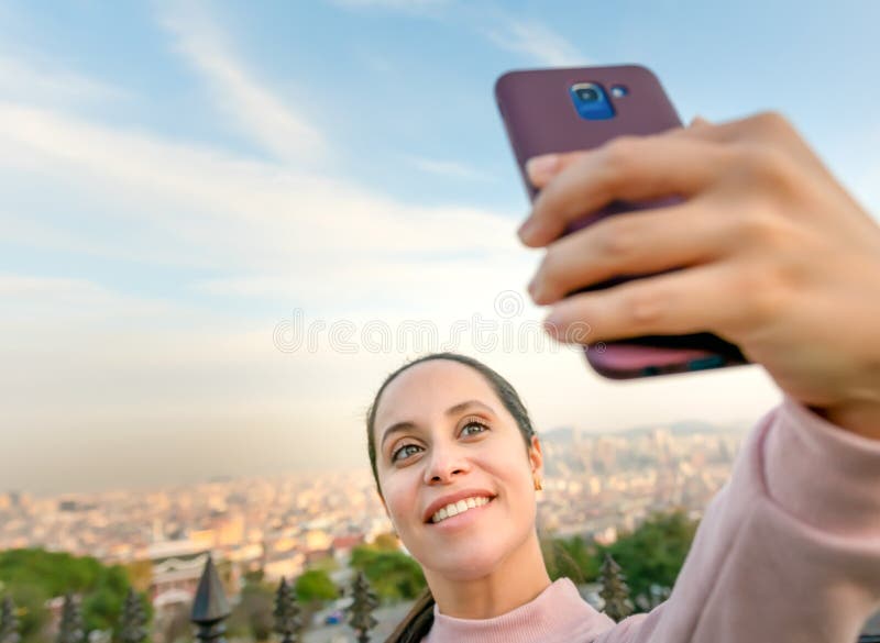 Girl is taking a landscape photo