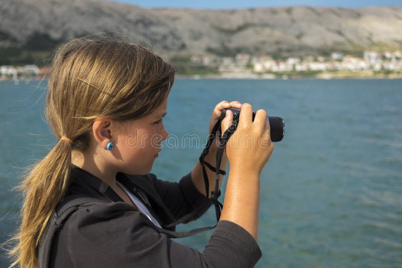 Girl is taking a photo stock images Girl is taking a photo stock images