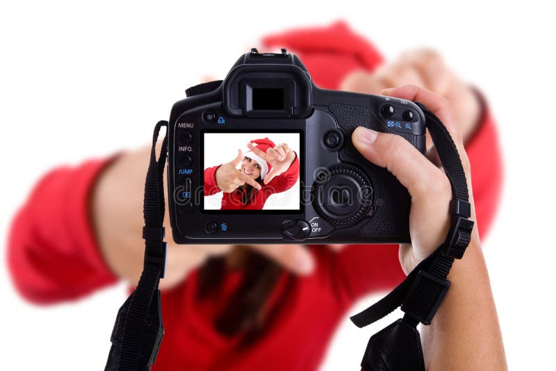 Girl taking photos to a santa woman in christmas