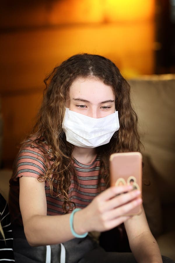 Girl Taking a Selfie with a Mask Stock Photo Image of virus, germs