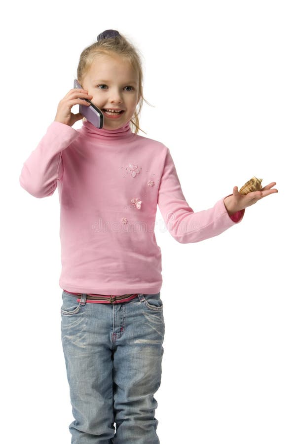 Girl talking by mobile phone royalty free stock photography
