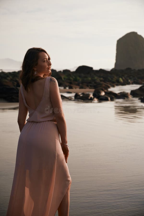 Girl with a Tattoo on the Beach Femininity a Walk on the Beach at Sunset  Vertical Shot Oregon USA Cannon Beach Stock Image  Image of beach  relax 174744937