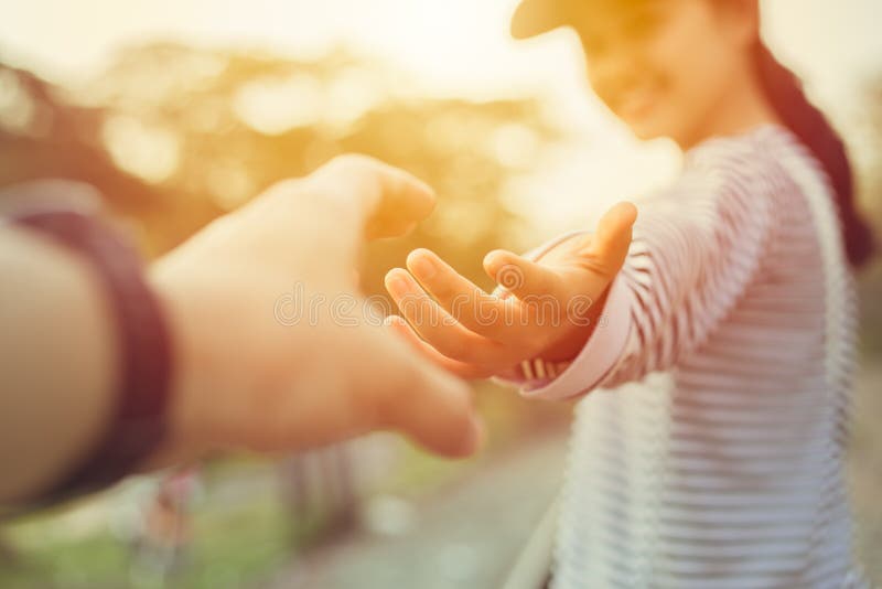 Girl teen smiling and reach her hand. Help Touch Care Support be a Good Friend with Love concept outdoor sun shine scene