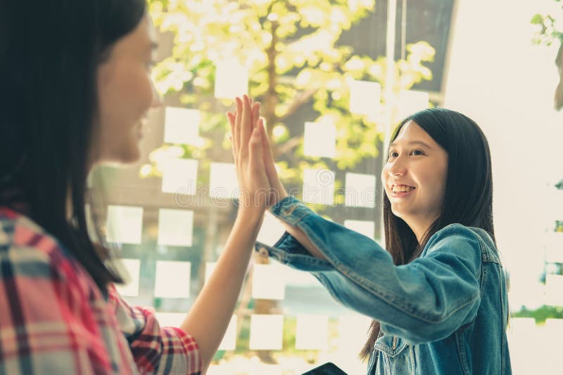 Girl Teenager Giving High Five Touching Hands Together. Team