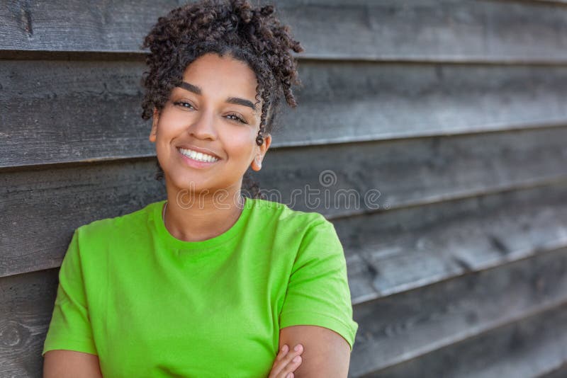 Girl teenager teen female young African American woman outside smiling with perfect teeth