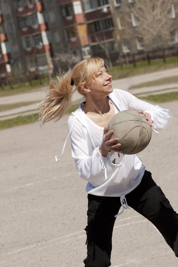 Girl throwing the ball stock image. Image of play, college 16757399