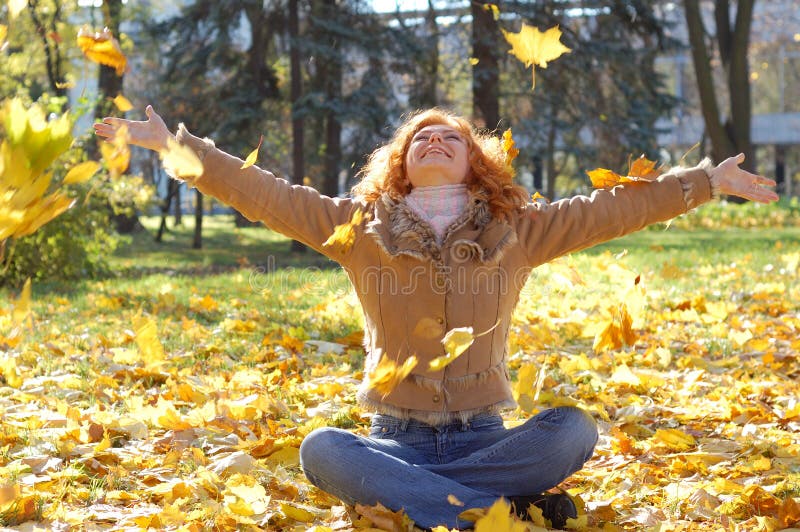 Girl throwing leaves