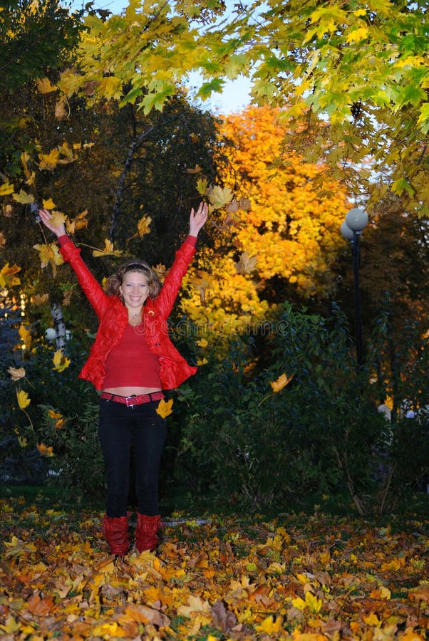 The Girl Throws Autumn Leaves Upwards Stock Photo - Image of model ...