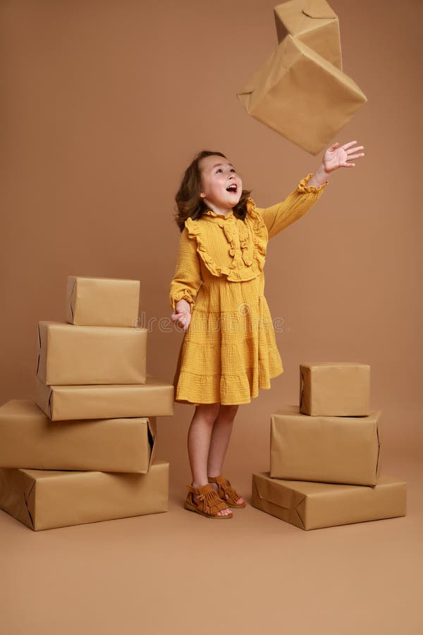 Girl tossing a box with a gift