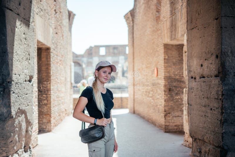 A girl tourist in Ancient Colosseum in Rome, Italy famous travel destinations royalty free stock photos