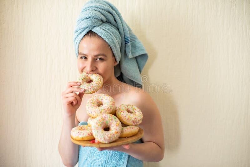 A Young Attractive Girl with Very Large Breasts in Underwear Lies on Her  Back and Straightens Her Hair on Her Head. Stock Photo - Image of boobs,  bedclothes: 162057774