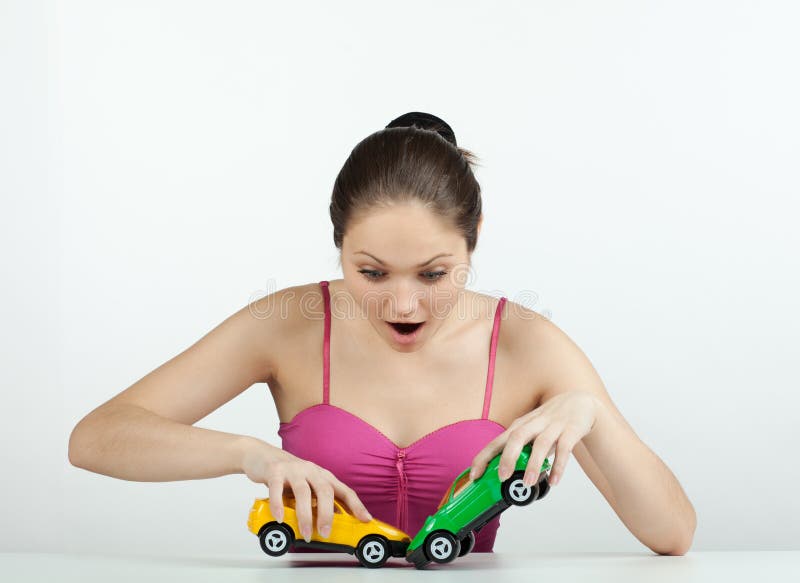 Girl with toy cars stock images