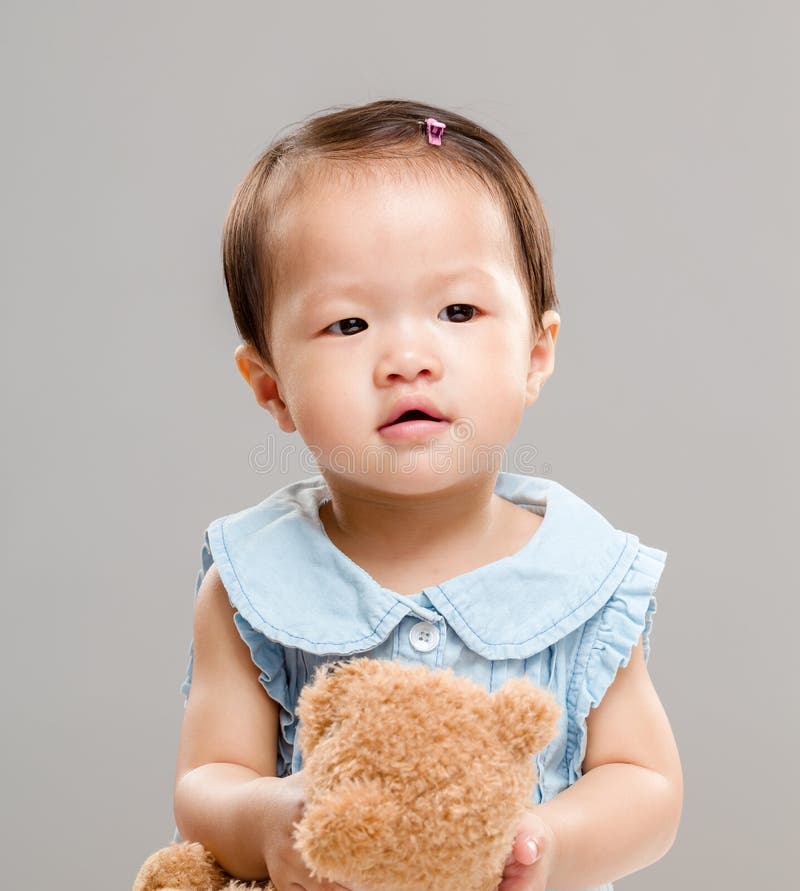 Girl with toy doll stock image. Image of careful, happiness 40944005