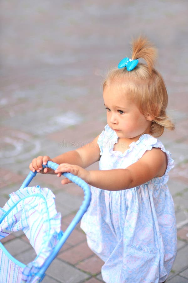 Girl with toy pram