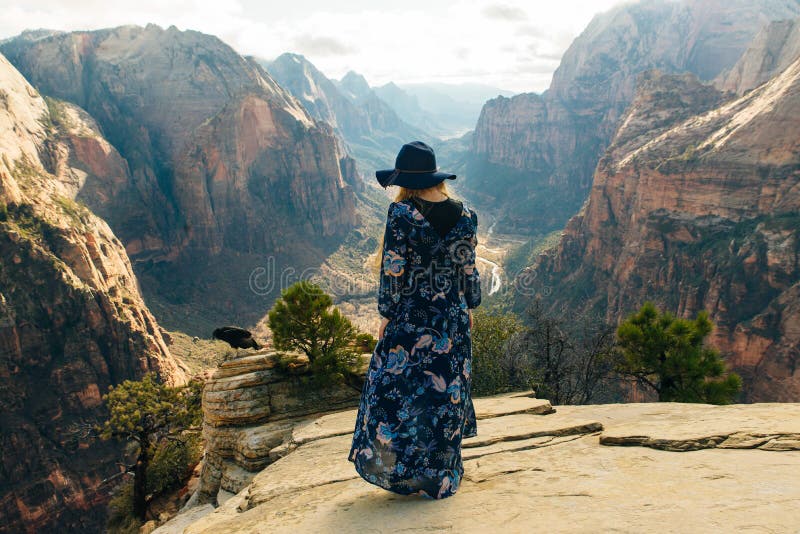 Girl traveller on Zion National Park in southwestern Utah near the town of Springdale, USA. Zion National Park is an American national park located in stock images Girl traveller on Zion National Park in southwestern Utah near the town of Springdale, USA. Zion National Park is an American national park located in stock images