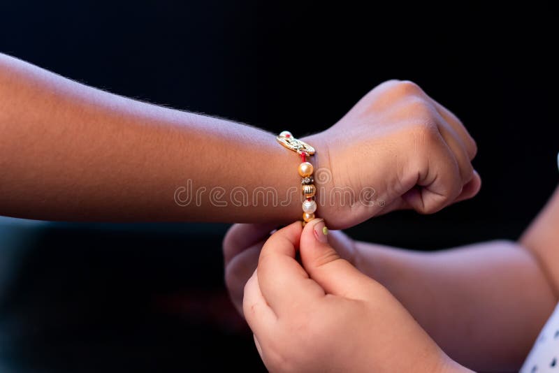 Girl tying Rakhi on Brother`s Hand. Raksha Bandan Indian Festival Brother and sister